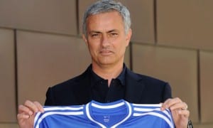 New Chelsea manager Jose Mourinho holds up the club shirt